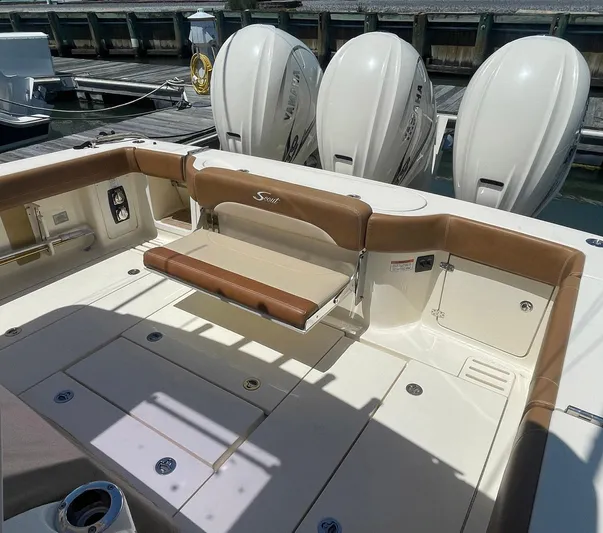 Shady Lady II Yacht Photos Pics 2019 Scout 380 LXF boat interior with seating and triple outboard engines.