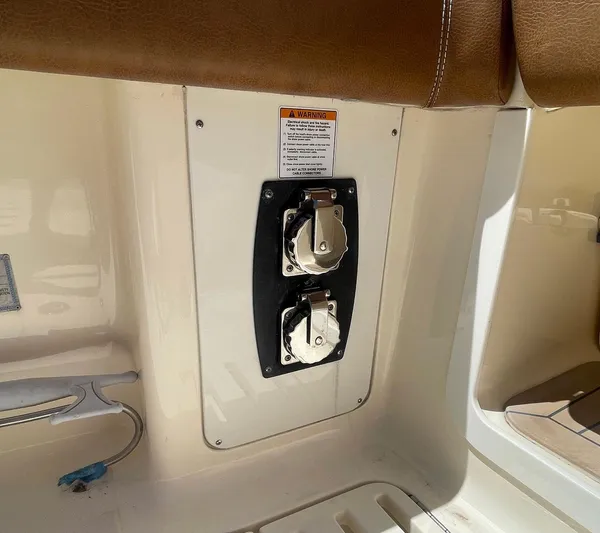 Shady Lady II Yacht Photos Pics 2019 Scout 380 LXF boat power outlets with warning label.