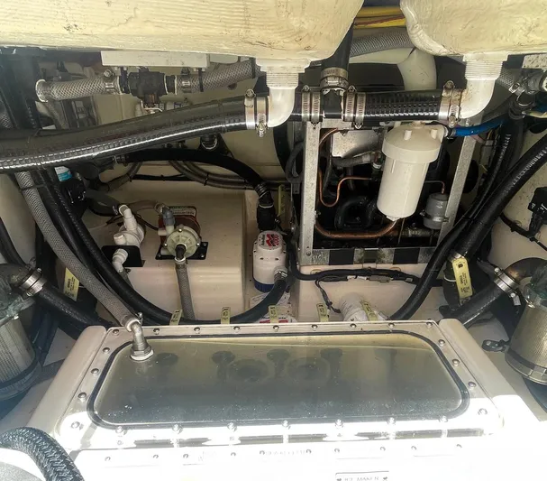 Shady Lady II Yacht Photos Pics Engine compartment of a 2019 Scout 380 LXF boat, showcasing various mechanical components.
