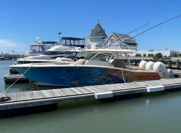 Shady Lady II Yacht Photos Pics 2019 Scout 380 LXF boat docked at marina with vibrant hull design.