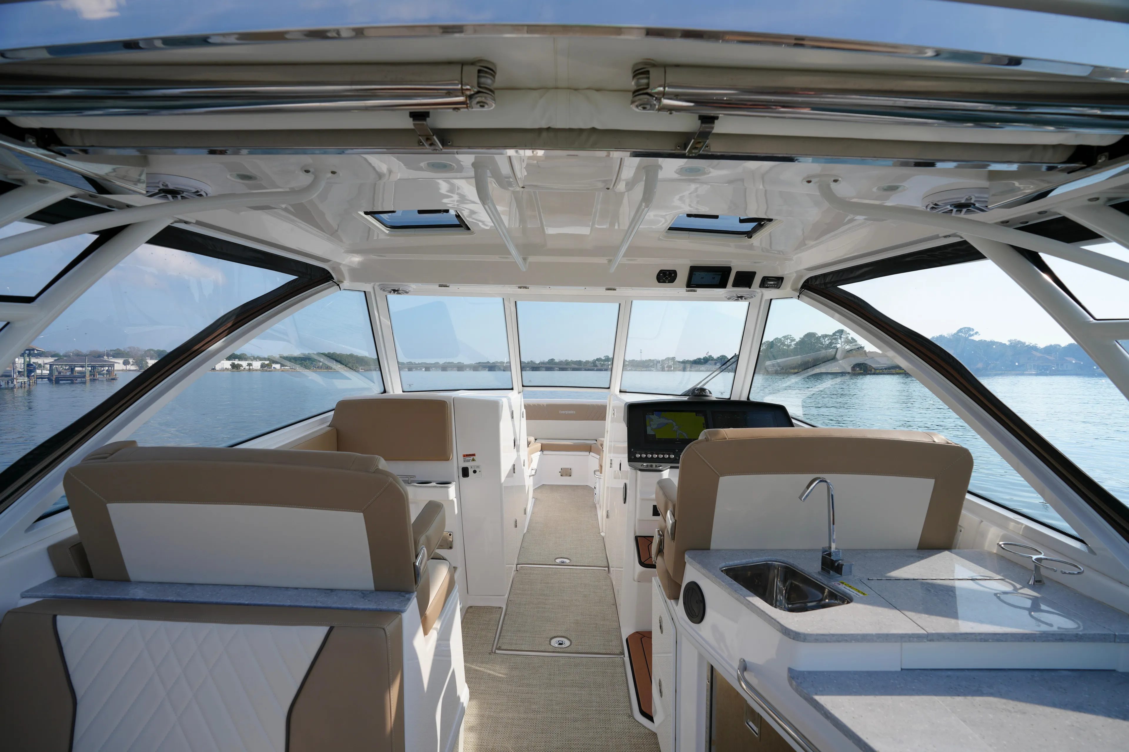  Yacht Photos Pics Interior view of 2023 Everglades 340 Dual Console boat with luxurious seating and navigation system.