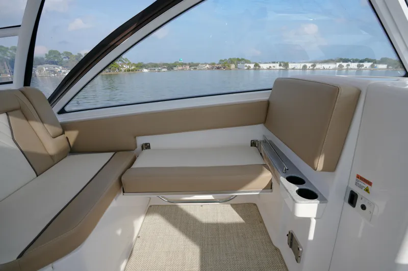  Yacht Photos Pics Interior of 2023 Everglades 340 Dual Console boat with beige seating and lake view.