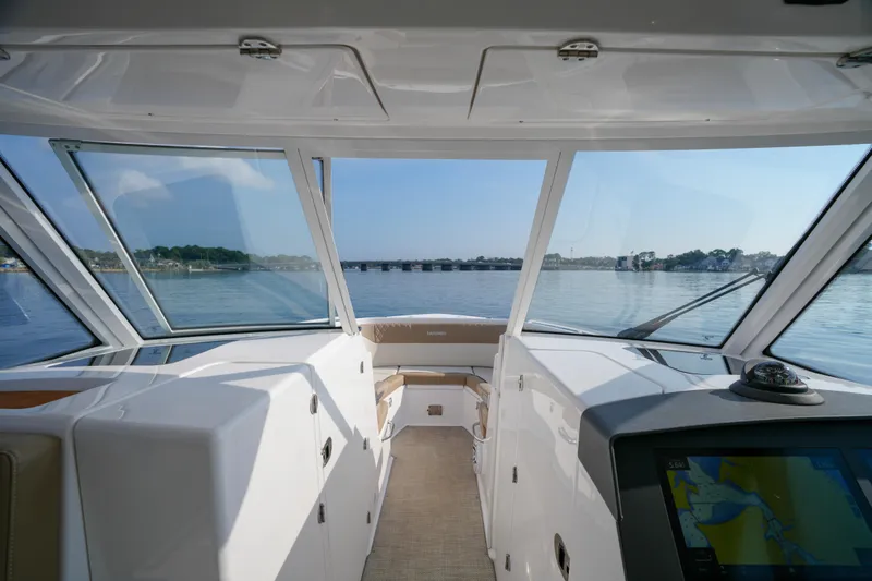  Yacht Photos Pics Interior view of 2023 Everglades 340 Dual Console boat with navigation display.