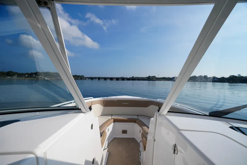  Yacht Photos Pics 2023 Everglades 340 Dual Console boat interior with scenic water view.