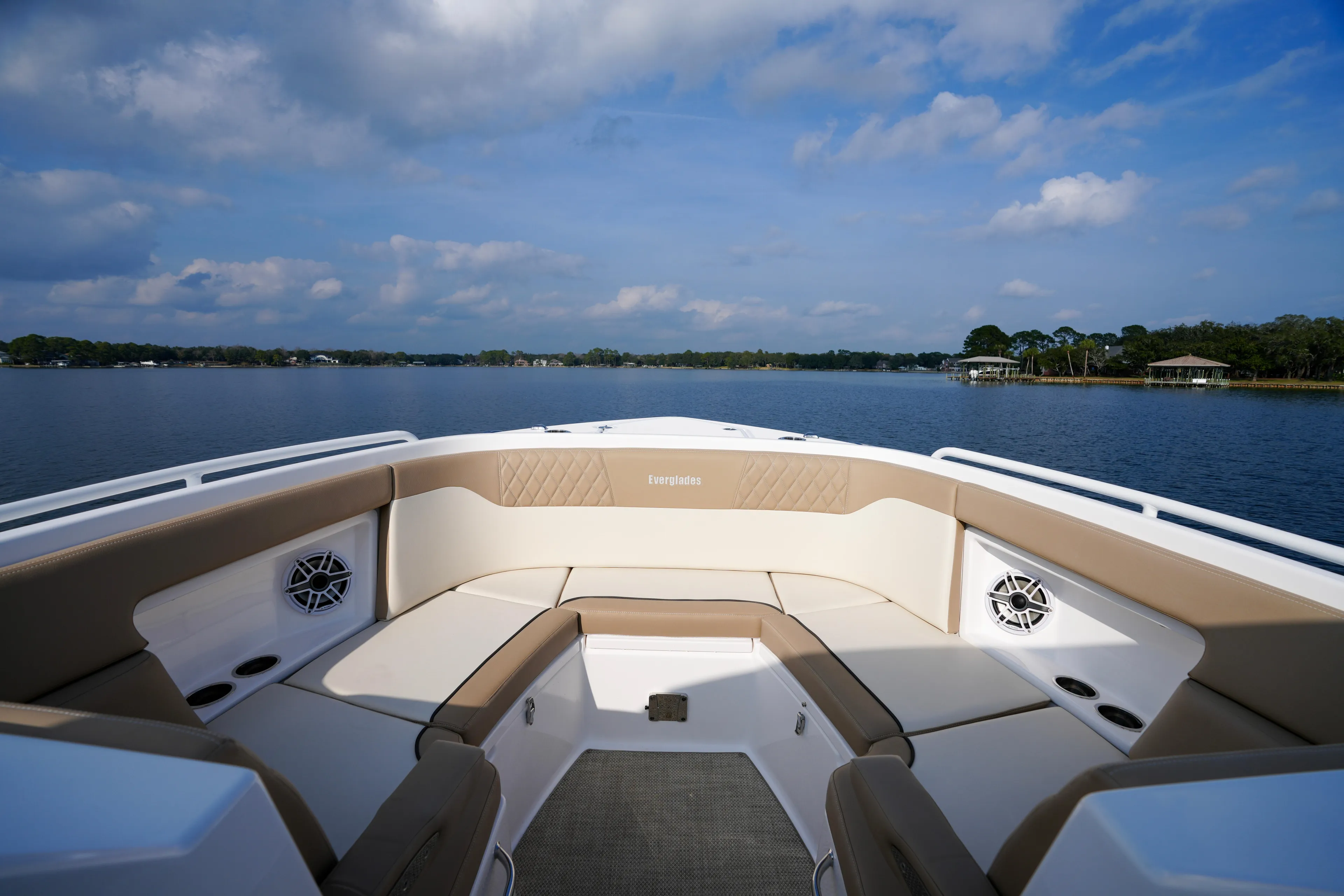  Yacht Photos Pics 2023 Everglades 340 Dual Console boat interior with lake view, featuring beige seating.