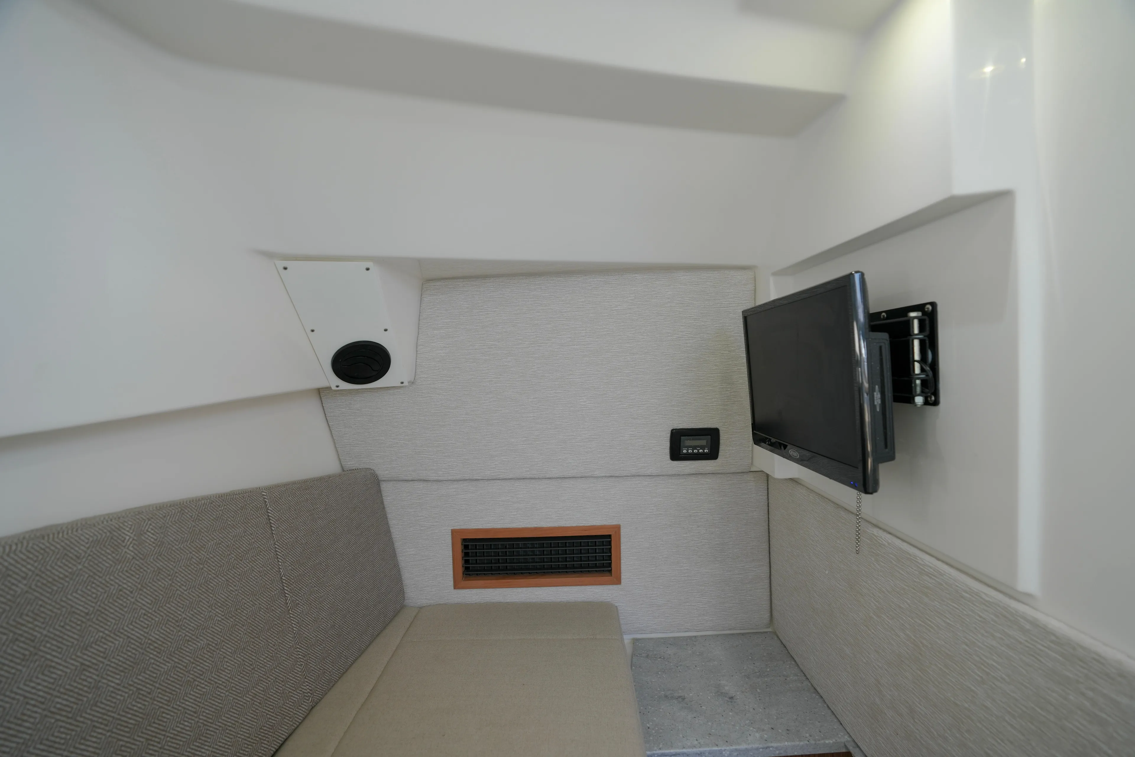  Yacht Photos Pics Interior of 2023 Everglades 340 Dual Console boat with TV and seating area.