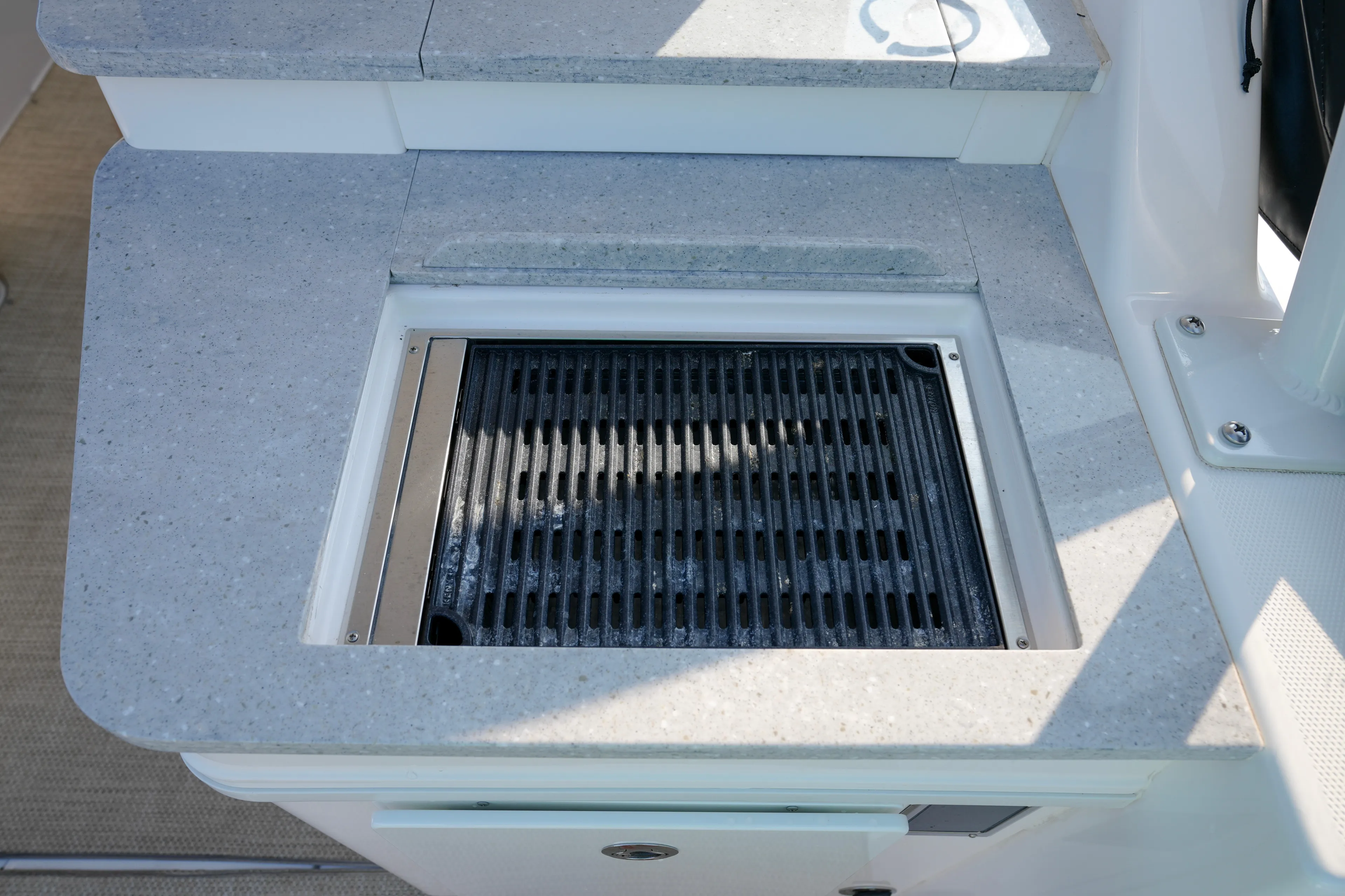  Yacht Photos Pics Built-in grill on 2023 Everglades 340 Dual Console boat, featuring sleek countertop design.