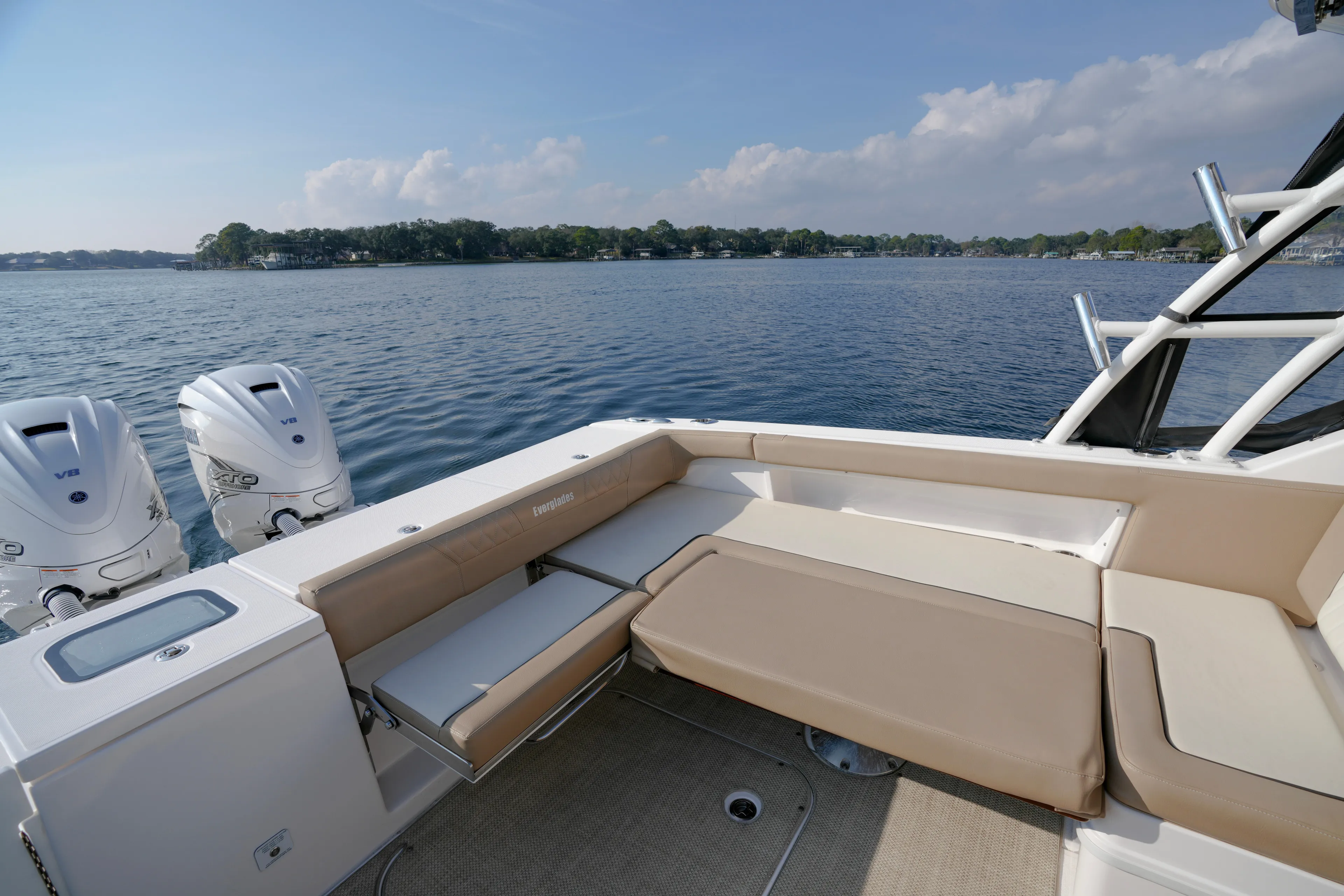  Yacht Photos Pics 2023 Everglades 340 Dual Console boat with twin V8 engines on a serene lake.