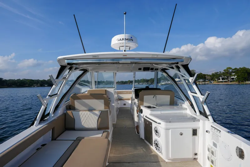  Yacht Photos Pics 2023 Everglades 340 Dual Console boat on water, featuring spacious seating and modern amenities.