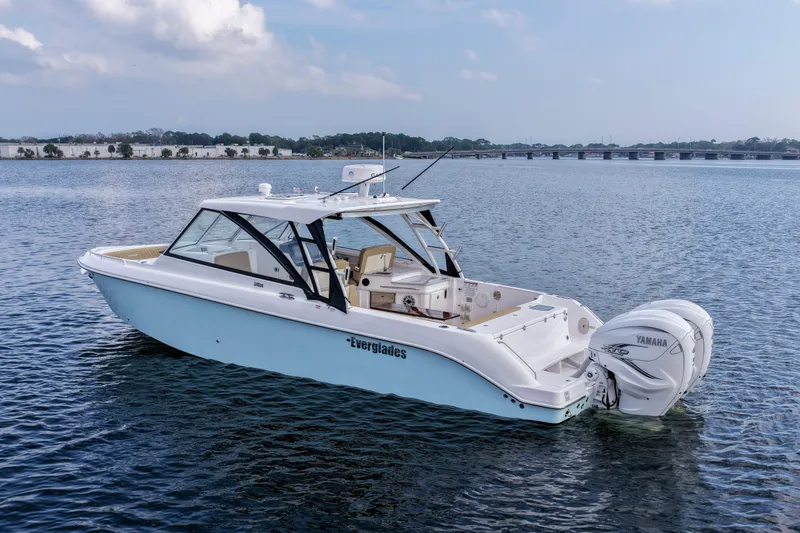  Yacht Photos Pics 2023 Everglades 340 Dual Console boat on calm water with Yamaha engines.