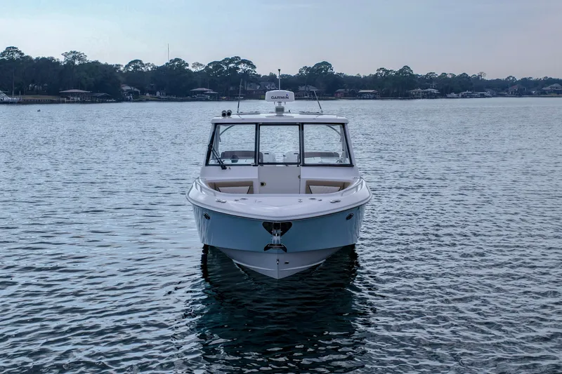  Yacht Photos Pics 2023 Everglades 340 Dual Console boat on calm water, front view.