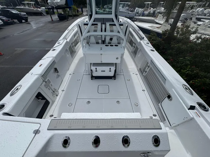  Yacht Photos Pics 2026 Blackfin 302 CC boat interior with spacious deck and modern features.