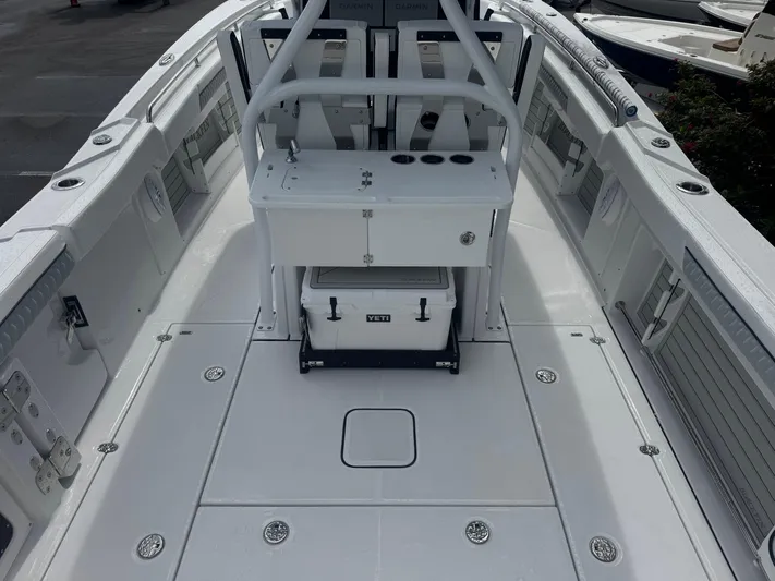  Yacht Photos Pics 2026 Blackfin 302 CC boat deck with seating and storage compartments.