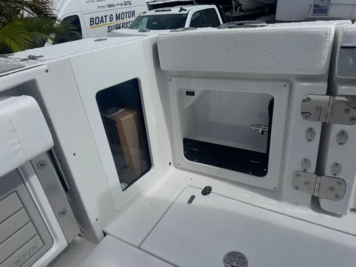  Yacht Photos Pics 2026 Blackfin 302 CC boat interior with storage compartments and sleek design.