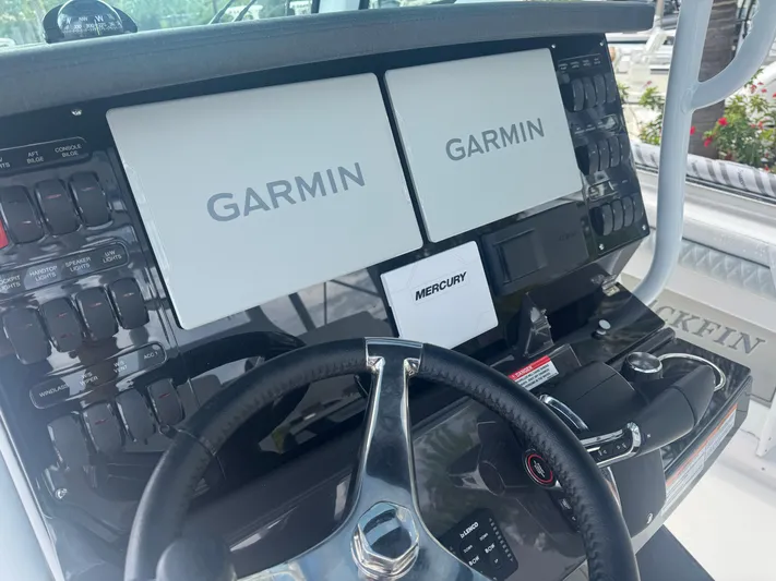  Yacht Photos Pics 2026 Blackfin 302 CC boat dashboard with Garmin displays and Mercury controls.