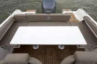 2023 Pacific Craft 750 Open boat interior with seating and table, featuring a 225 horsepower engine.