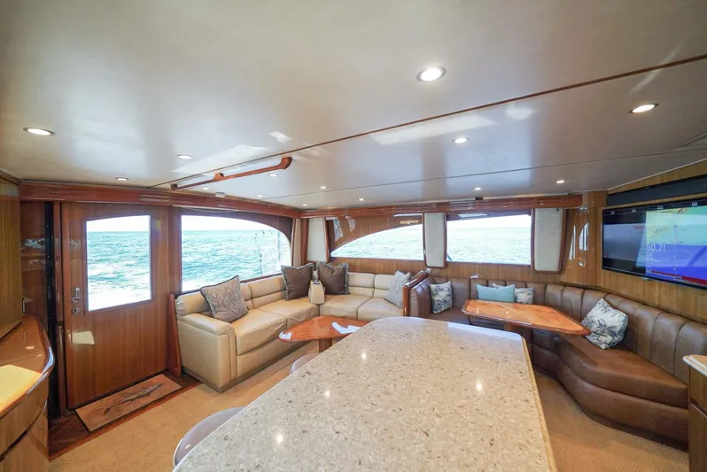 Synchronicity Yacht Photos Pics Luxurious interior of 2013 Viking 55 Convertible yacht with elegant seating and ocean view.