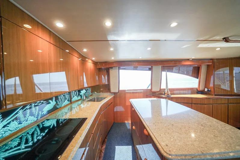 Synchronicity Yacht Photos Pics Luxurious interior of 2013 Viking 55 Convertible yacht with modern kitchen design.