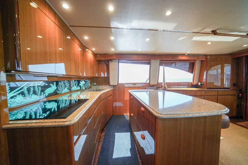 Synchronicity Yacht Photos Pics Luxurious interior of 2013 Viking 55 Convertible yacht with polished wood and modern design.