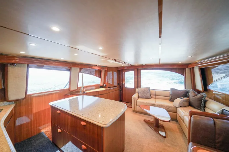 Synchronicity Yacht Photos Pics Luxurious interior of 2013 Viking 55 Convertible yacht with elegant wood finishes.