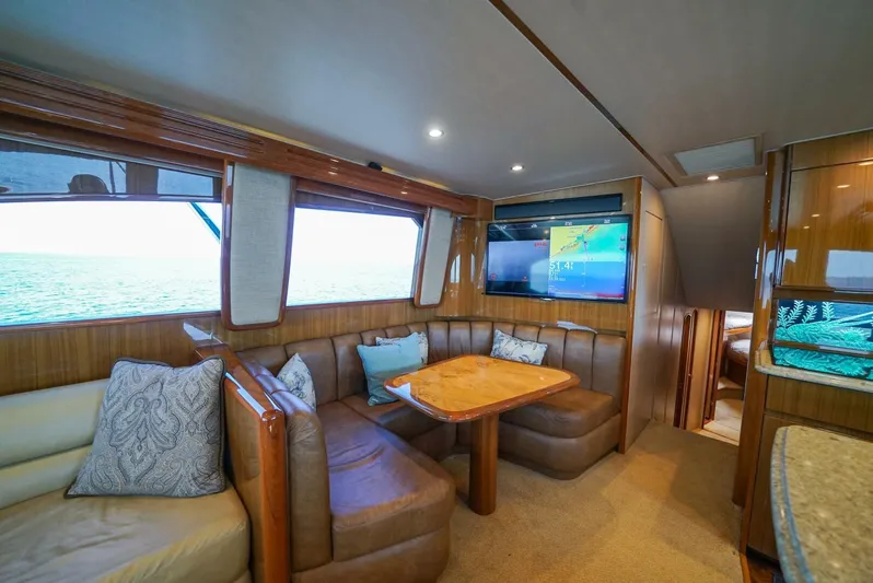 Synchronicity Yacht Photos Pics Luxurious interior of 2013 Viking 55 Convertible yacht with leather seating and ocean view.