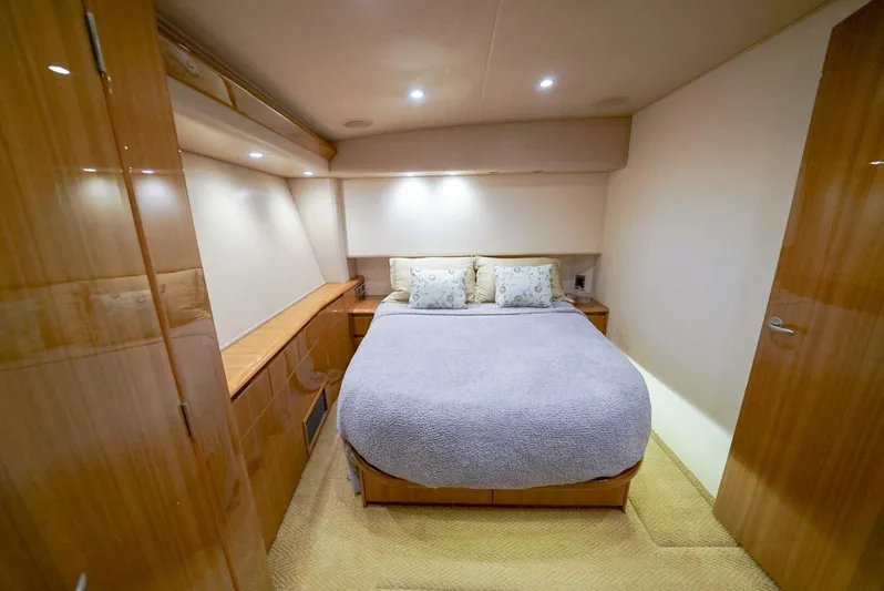 Synchronicity Yacht Photos Pics Luxurious bedroom interior of 2013 Viking 55 Convertible yacht with cozy bedding.