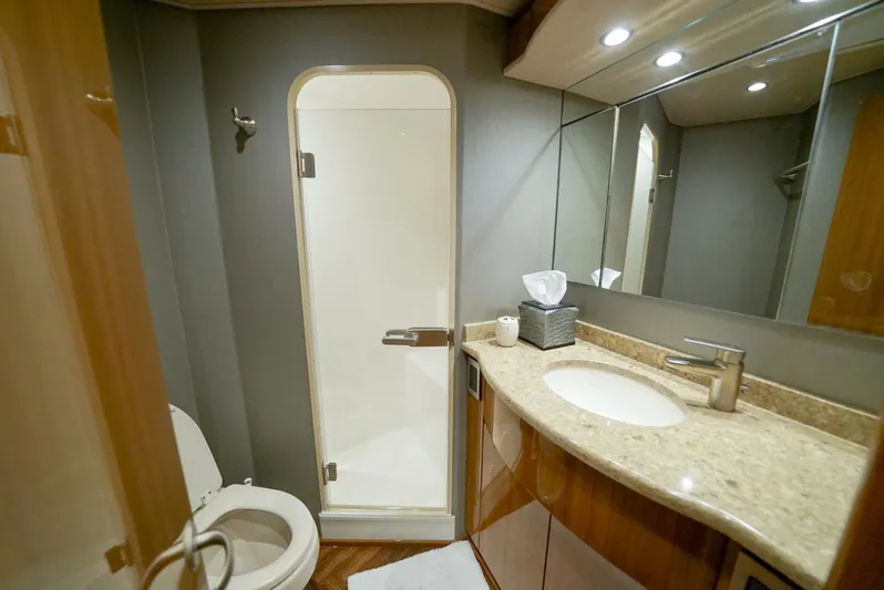 Synchronicity Yacht Photos Pics Luxurious bathroom in 2013 Viking 55 Convertible yacht with modern fixtures and elegant design.