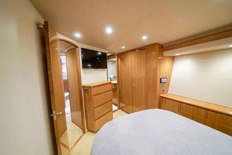 Synchronicity Yacht Photos Pics Luxurious interior of 2013 Viking 55 Convertible yacht with wood finish and modern amenities.