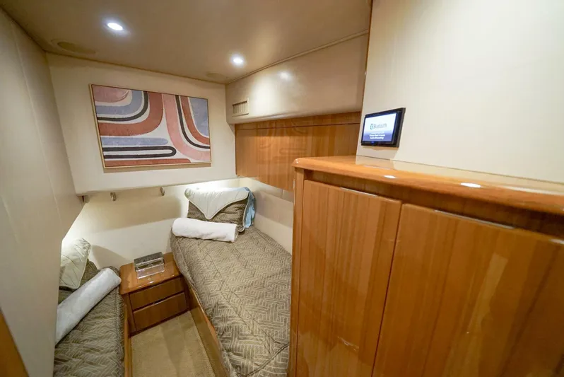 Synchronicity Yacht Photos Pics Luxurious cabin interior of 2013 Viking 55 Convertible yacht with twin beds.
