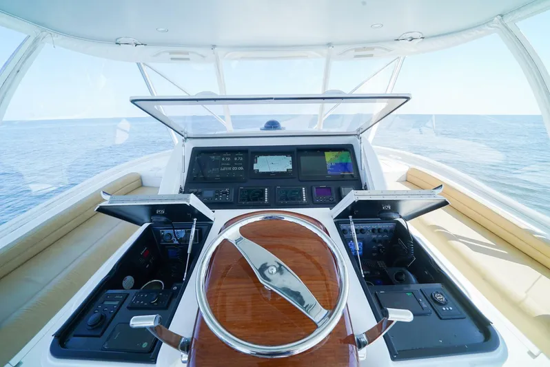 Synchronicity Yacht Photos Pics 2013 Viking 55 Convertible yacht helm with advanced navigation controls.