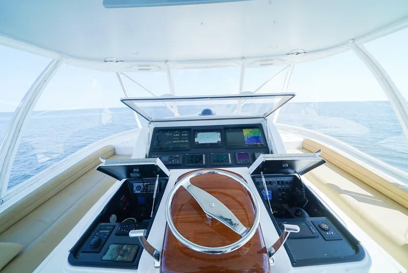 Synchronicity Yacht Photos Pics 2013 Viking 55 Convertible yacht helm with advanced navigation controls and ocean view.