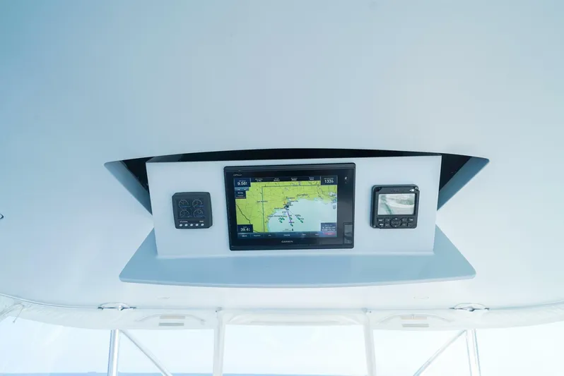 Synchronicity Yacht Photos Pics Viking 55 Convertible 2013 boat dashboard with navigation display and controls.