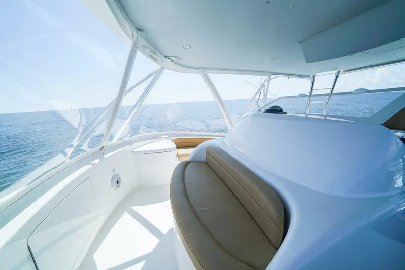 Synchronicity Yacht Photos Pics 2013 Viking 55 Convertible yacht interior with ocean view and seating area.