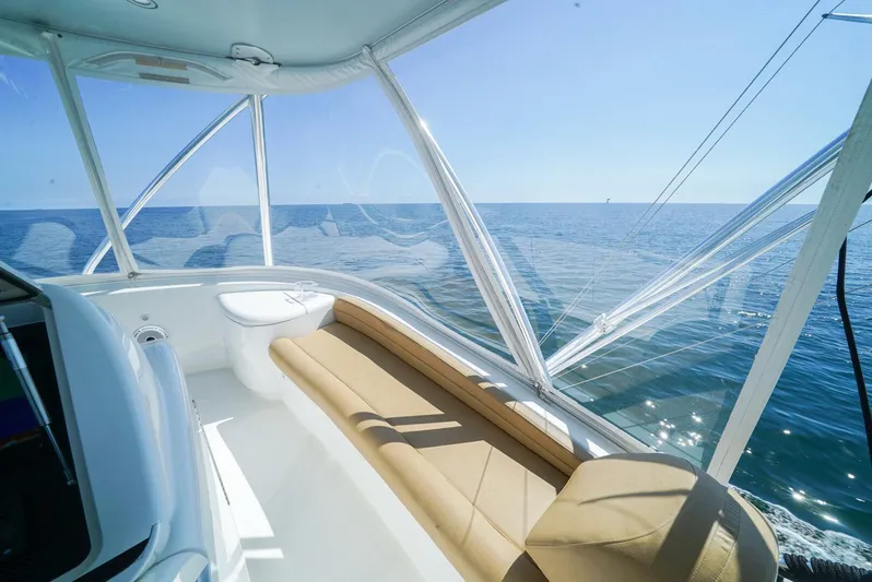 Synchronicity Yacht Photos Pics Luxurious interior of 2013 Viking 55 Convertible yacht with ocean view.