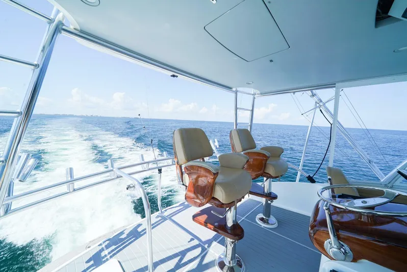 Synchronicity Yacht Photos Pics Viking 55 Convertible 2013 yacht interior with ocean view and captain's chairs.