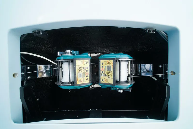 Synchronicity Yacht Photos Pics Engine compartment of 2013 Viking 55 Convertible boat, showcasing dual machinery.