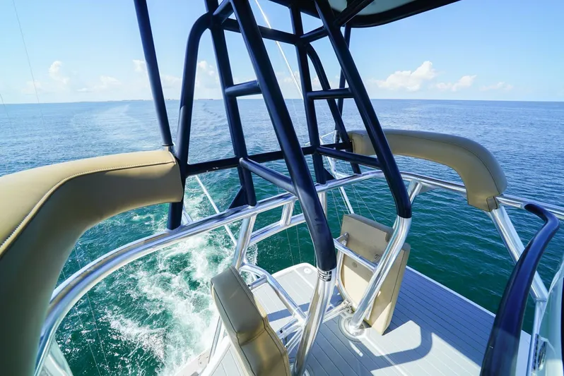 Synchronicity Yacht Photos Pics 2013 Viking 55 Convertible yacht, ocean view from upper deck, clear blue sky.