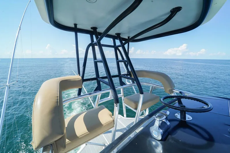 Synchronicity Yacht Photos Pics 2013 Viking 55 Convertible yacht helm overlooking ocean.