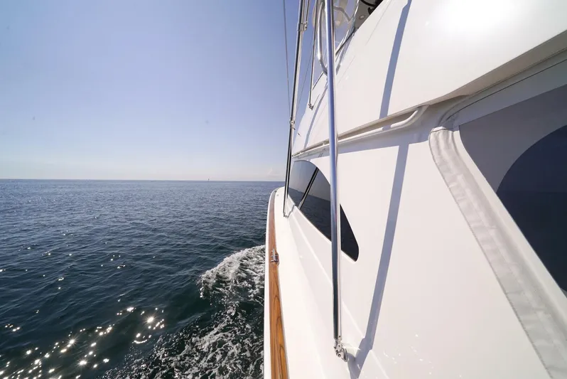 Synchronicity Yacht Photos Pics Viking 55 Convertible yacht cruising on open sea, 2013 model.