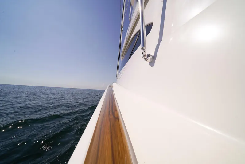 Synchronicity Yacht Photos Pics Side view of 2013 Viking 55 Convertible yacht on open sea.