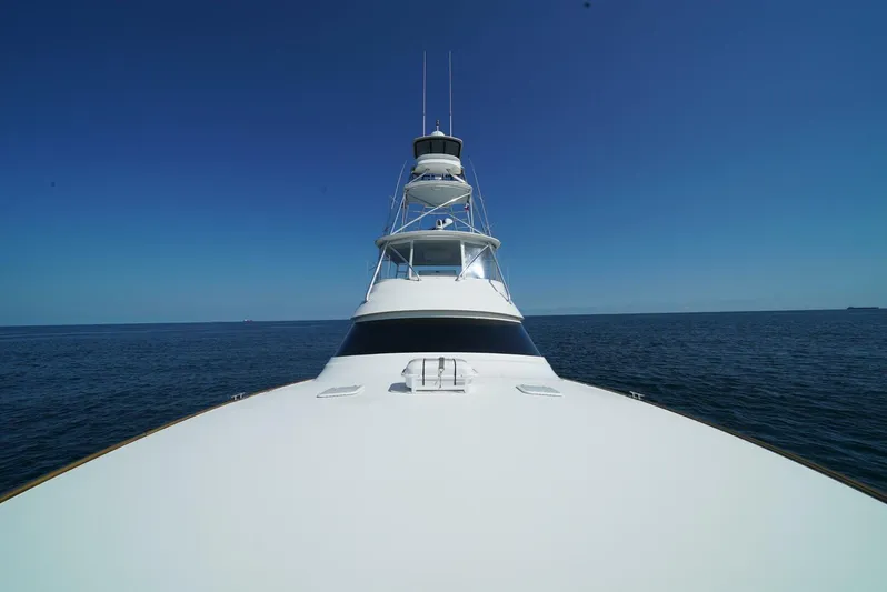 Synchronicity Yacht Photos Pics Viking 55 Convertible yacht, 2013 model, cruising on open sea under clear blue sky.