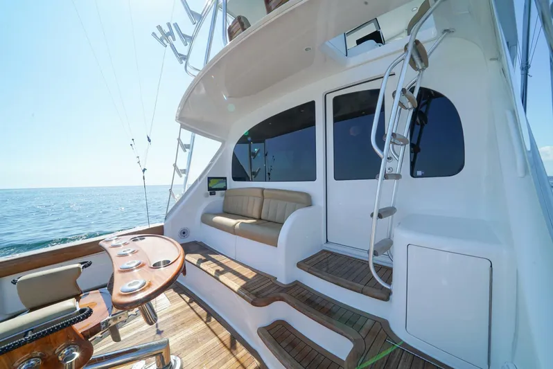 Synchronicity Yacht Photos Pics Viking 55 Convertible 2013 yacht deck with seating and ocean view.