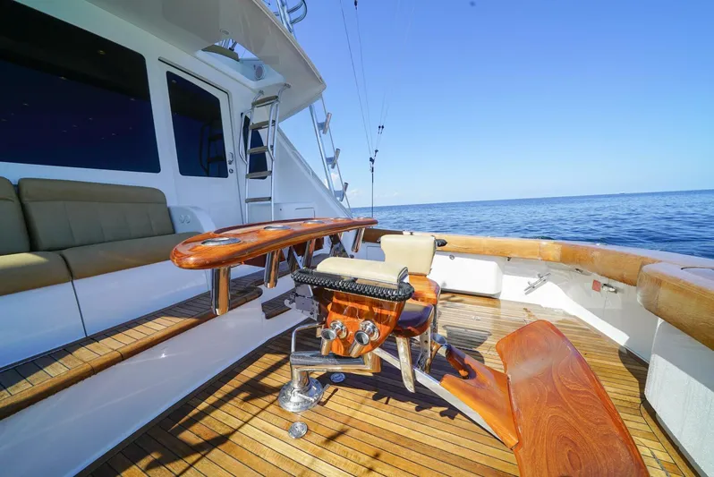 Synchronicity Yacht Photos Pics 2013 Viking 55 Convertible yacht deck with fishing chair and ocean view.