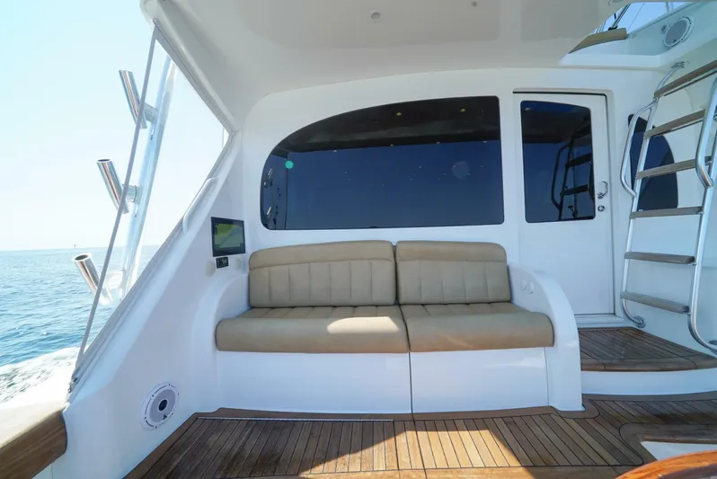 Synchronicity Yacht Photos Pics 2013 Viking 55 Convertible yacht interior with beige seating and ocean view.