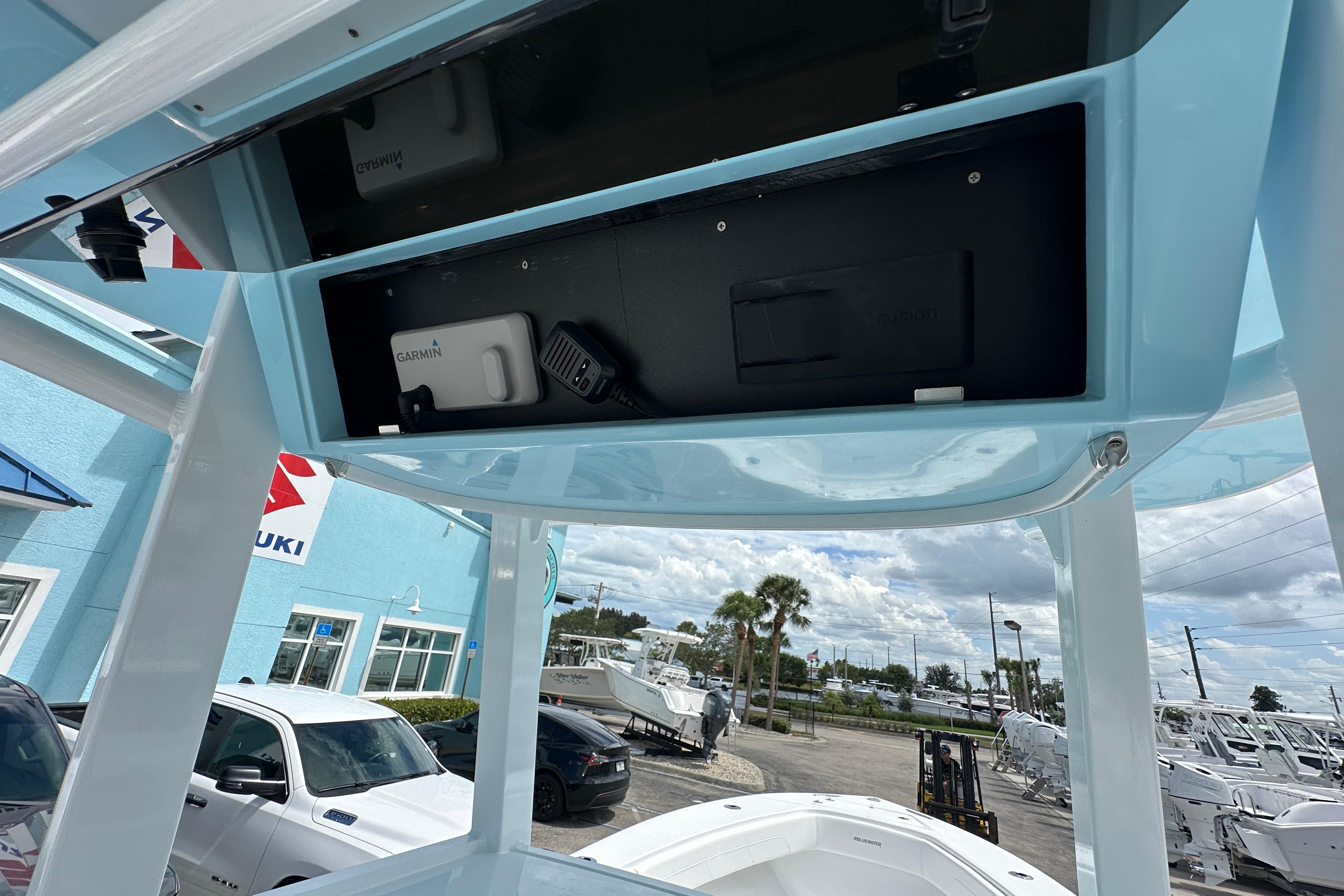 2026 Bluewater 25t boat console with Garmin electronics, parked at dealership.