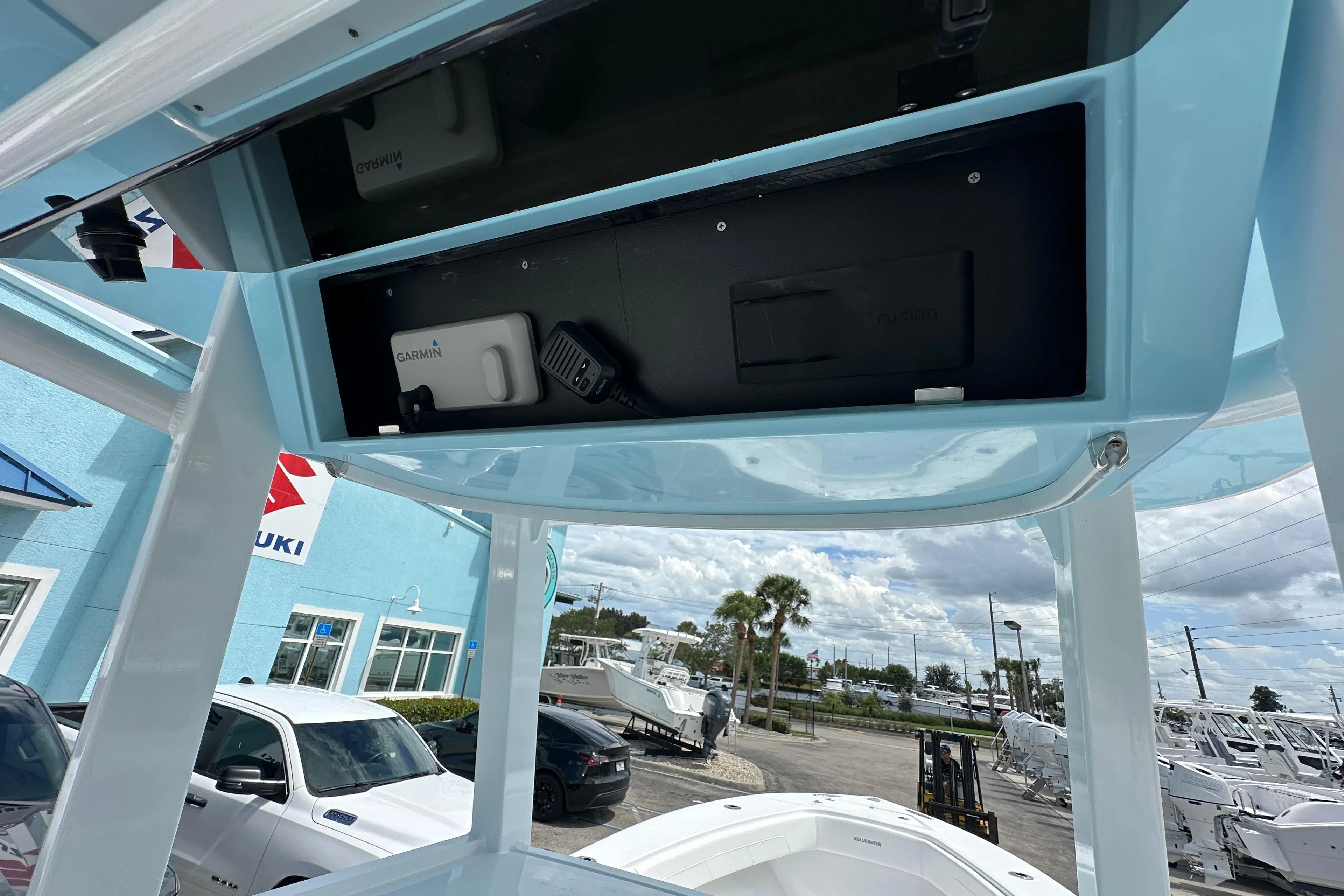 2026 Bluewater 25t boat console with Garmin electronics, parked at dealership.
