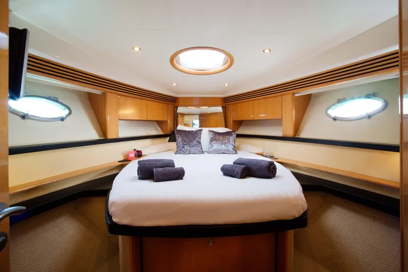  Yacht Photos Pics Luxurious cabin interior of 2006 Absolute 45 yacht with cozy bed and elegant decor.