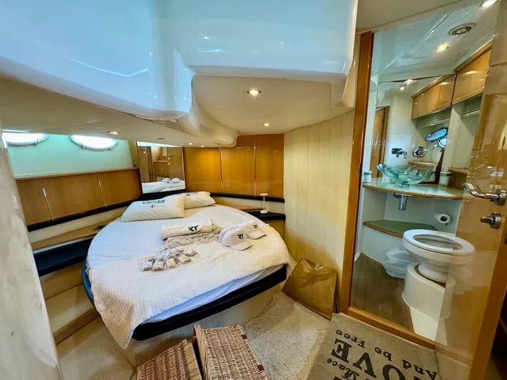  Yacht Photos Pics Luxurious cabin interior of a 2006 Absolute 45 yacht with cozy bed and modern bathroom.