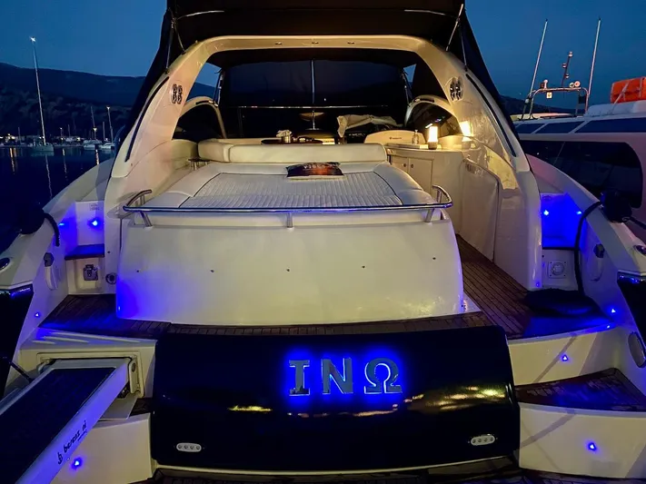  Yacht Photos Pics Luxury Absolute 45 yacht, 2006 model, illuminated with blue lights at night.