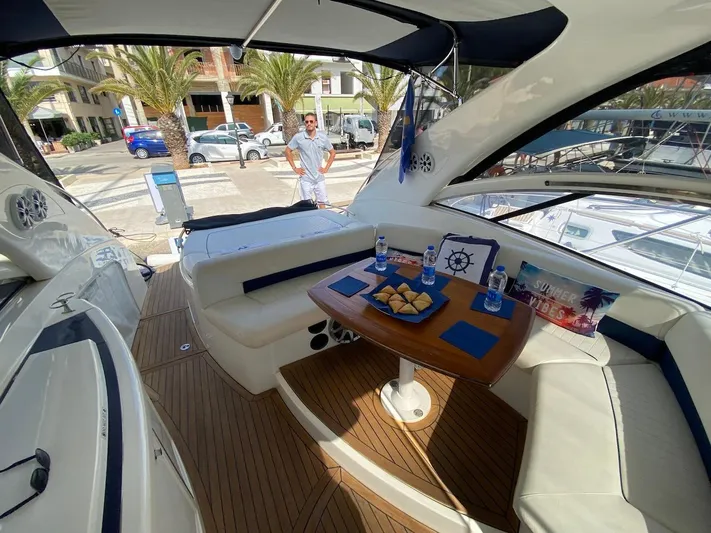  Yacht Photos Pics Luxurious 2006 Absolute 45 yacht interior with seating, table, and refreshments.